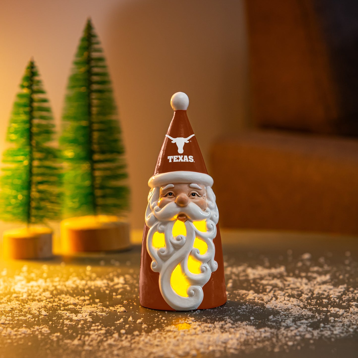 University of Texas Santa Decor Gift ceramic orange Santa with glowing cutout beard and Longhorn hat on snowy table