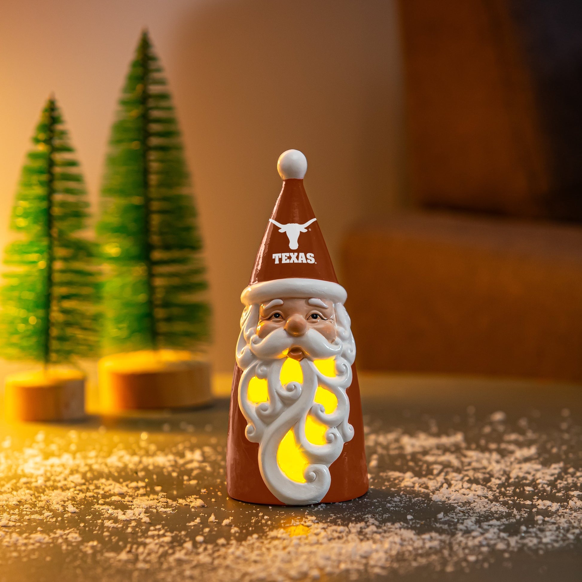 University of Texas Santa Decor Gift ceramic orange Santa with glowing cutout beard and Longhorn hat on snowy table