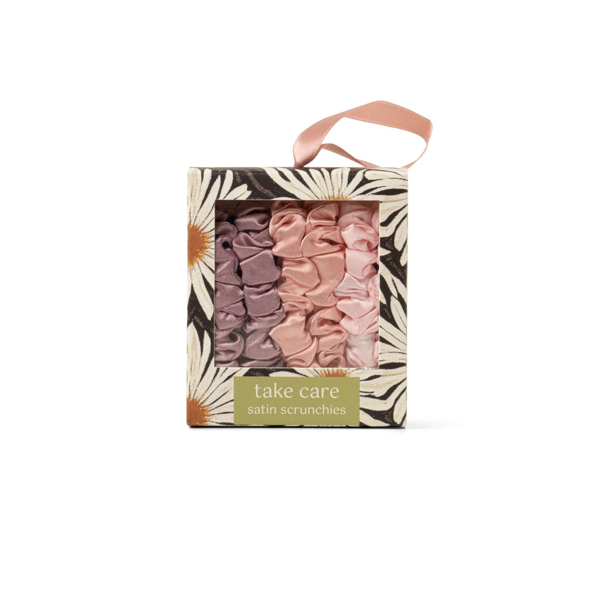DM Merchandising satin scrunchies in shades of pink packaged in floral box with handle